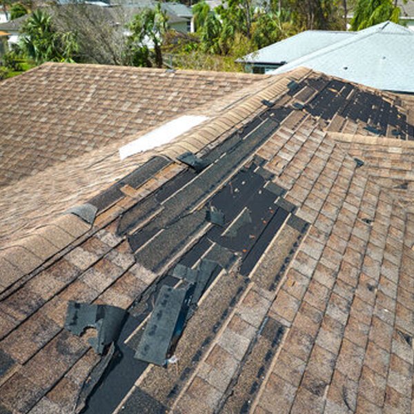 window damaged asphalt shingle roof